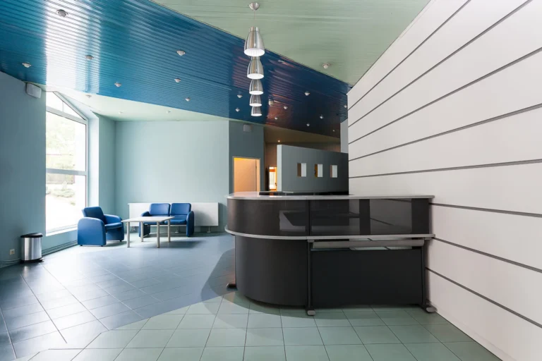A modern bank lobby and waiting area with a blue paint scheme